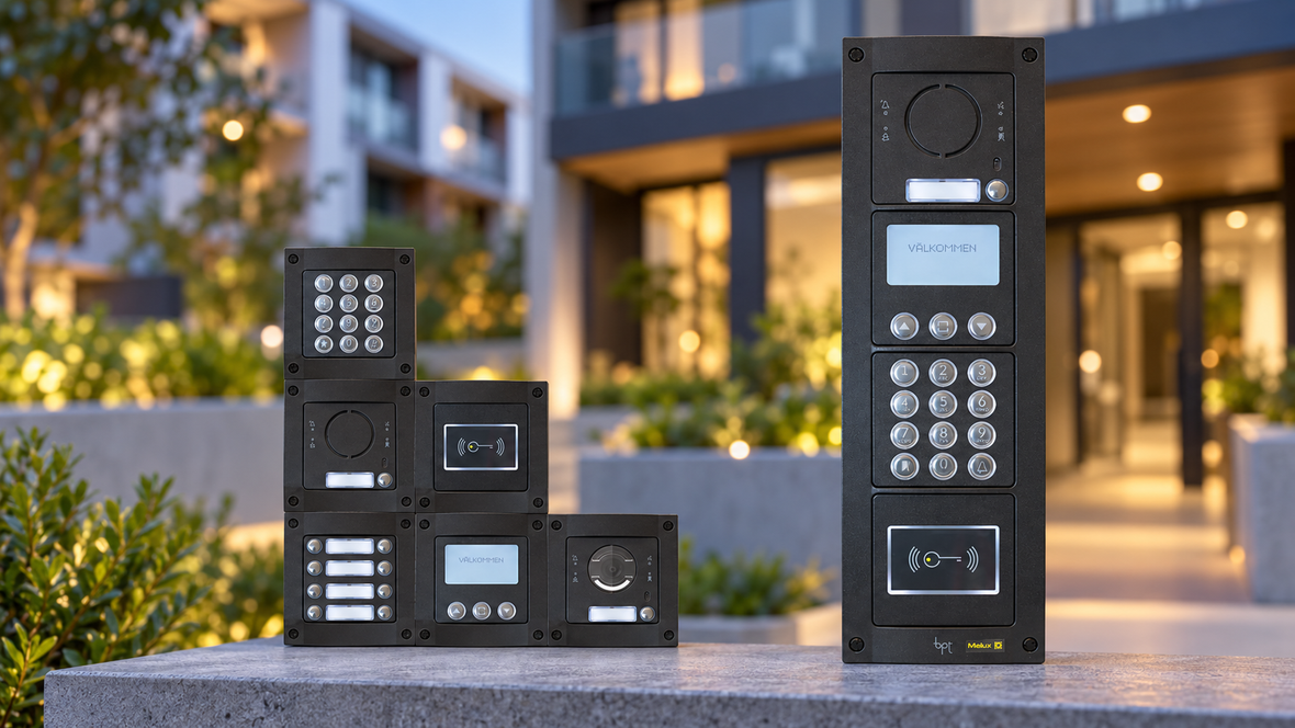 BPT modular intercom panels with keypads, call buttons and proximity readers in front of a blurred apartment complex.