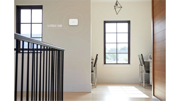 U-PROX Hub wireless security alarm control panel wall-mounted in a modern New Zealand home, providing residential security coverage.