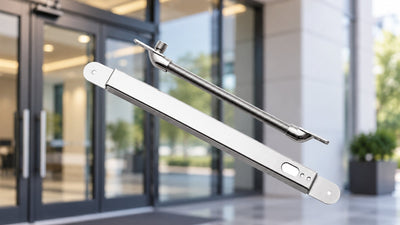 Lockwood commercial door hardware assembly with metal bracket and threaded rod, displayed against a modern commercial building entrance