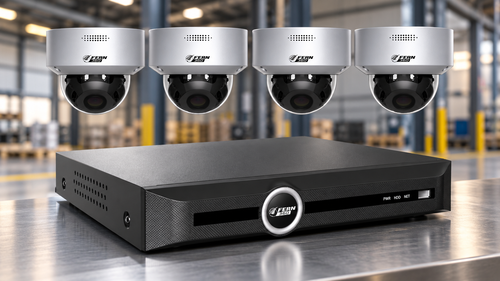 FERN360 four-camera CCTV security system with network video recorder on an industrial warehouse background.