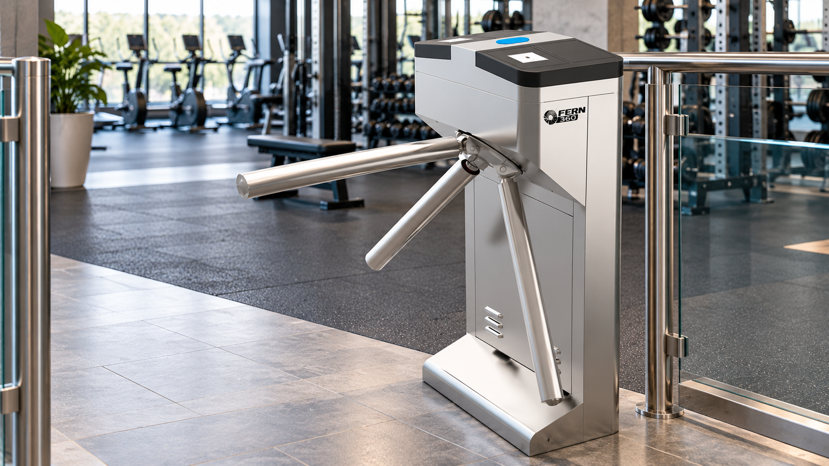 FERN360 tripod turnstile installed at the entrance of a modern commercial gym with fitness equipment in the background.