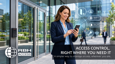 Woman using a smartphone for mobile access control at a modern office entrance, with a keypad reader and RBH Access branding.