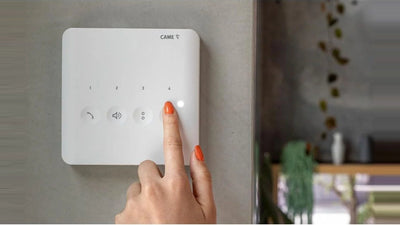 CAME wall-mounted hands-free intercom with touch controls in a modern residential interior, New Zealand.