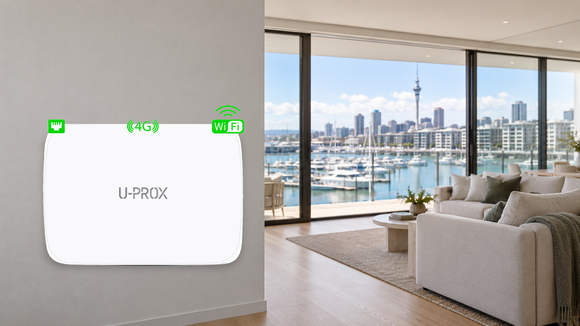 U-Prox wireless alarm hub mounted on a wall in a modern apartment overlooking Auckland’s Viaduct Harbour.